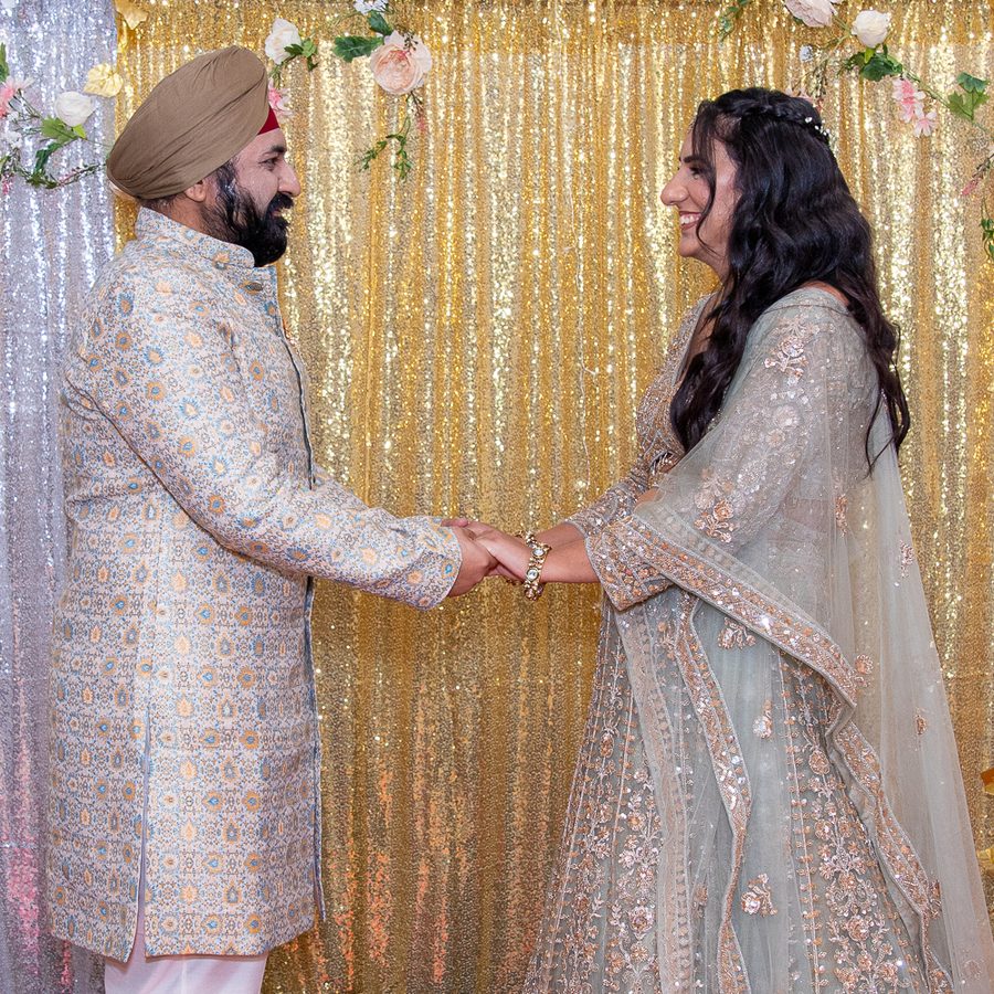 Isha and Aman, hand in hand, at their engagement
